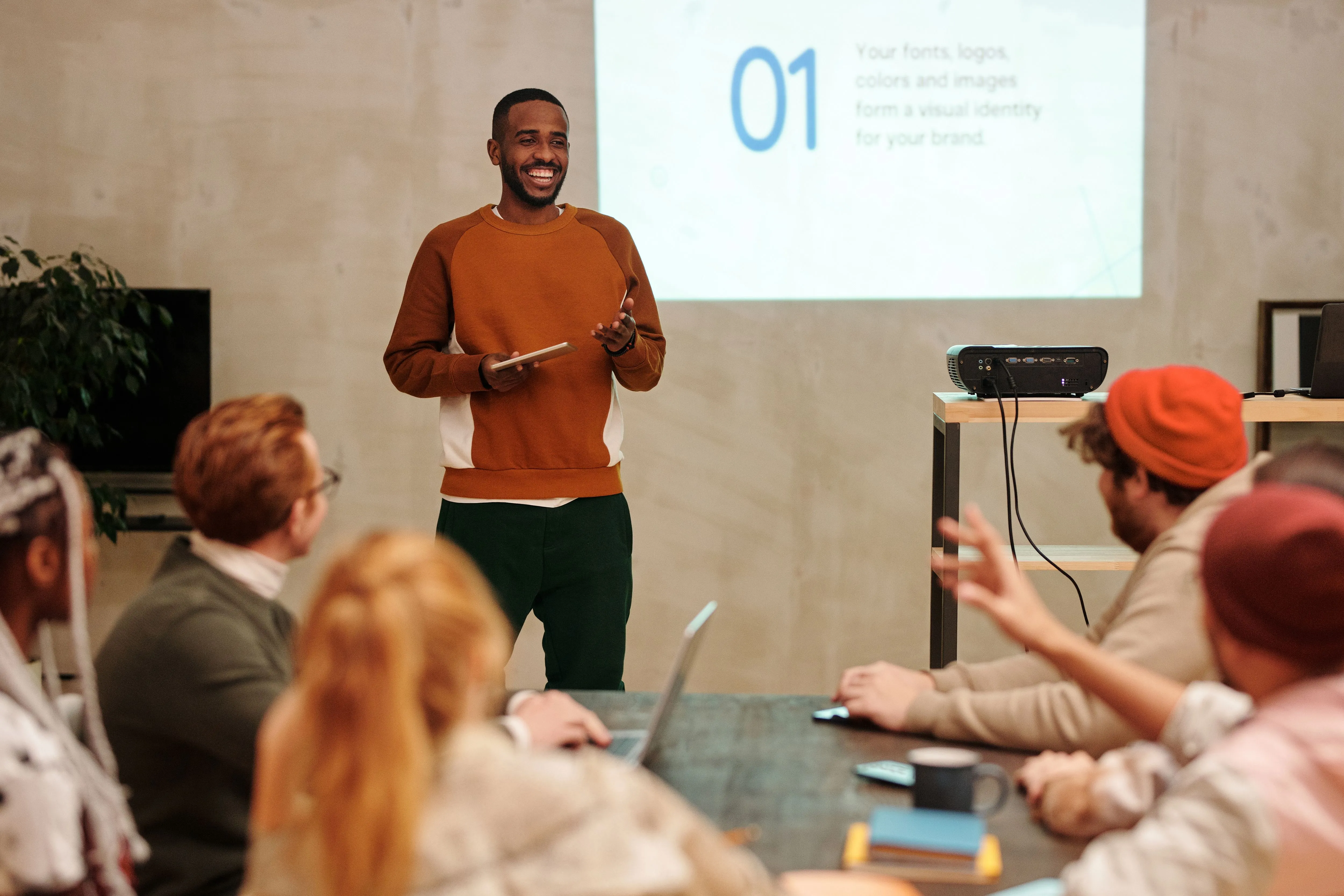 A Rize facilitator leading a technology workshop for a room of participants